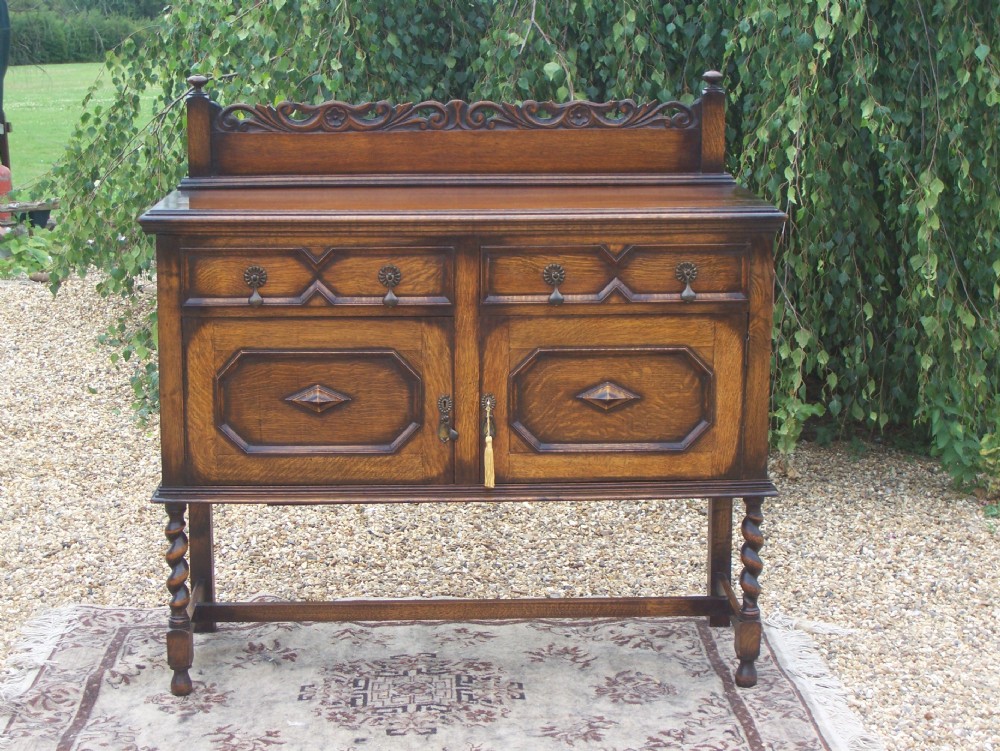 JACOBEAN STYLE OAK SIDEBOARD