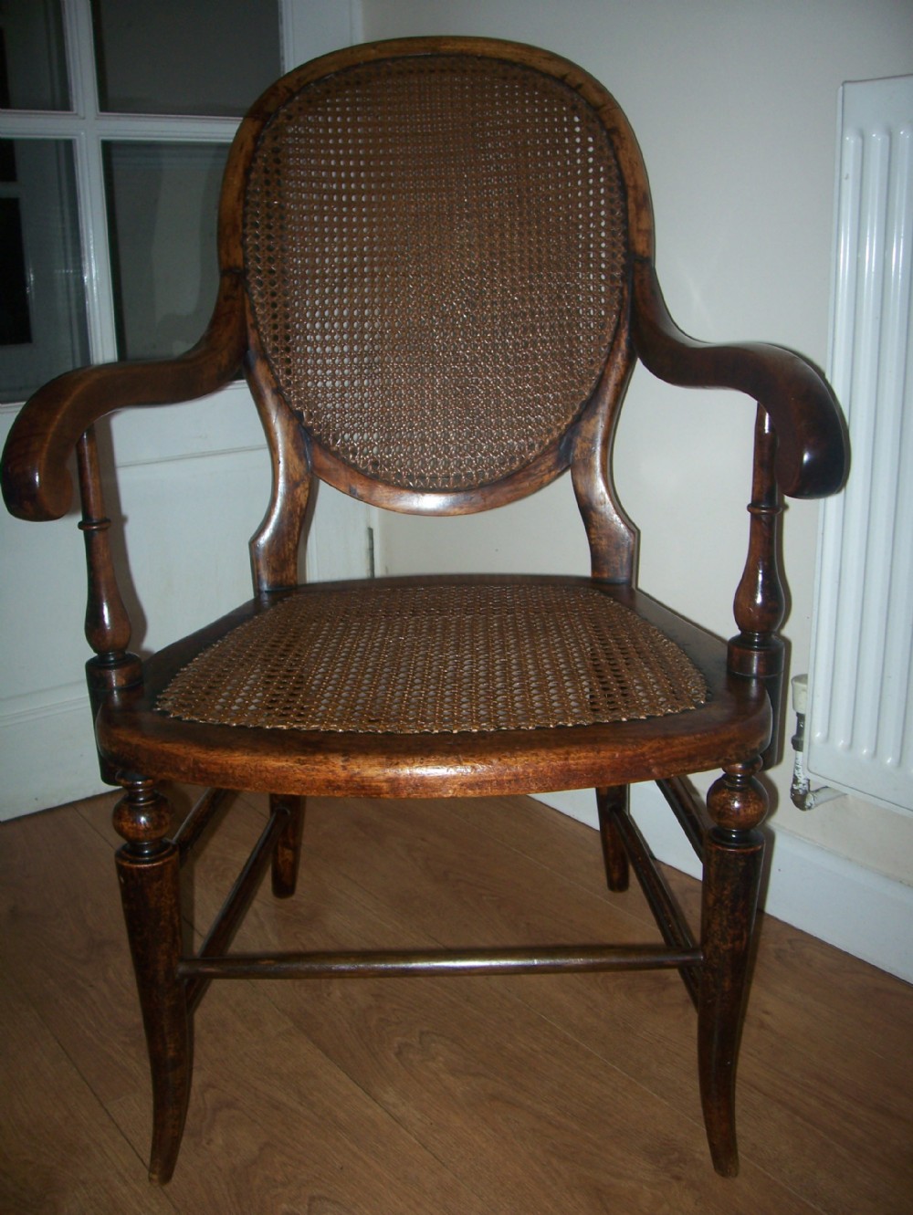 VICTORIAN OPEN ARM CHAIR WITH CANED SEAT AND BACK