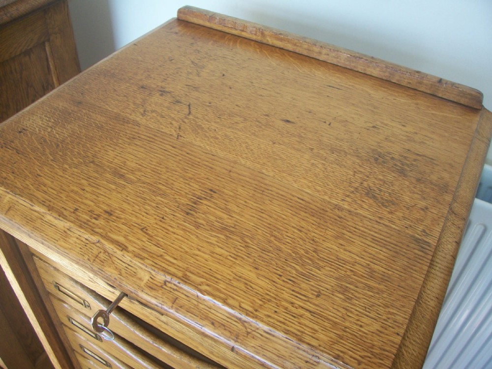 Single Edwardian oak tambour front 9 drawer filing cabinet View IX