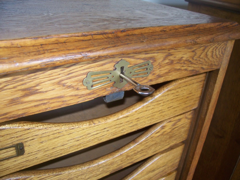 Single Edwardian oak filing cabinet with tambour front and 9 drawers 1 of 2 View IV
