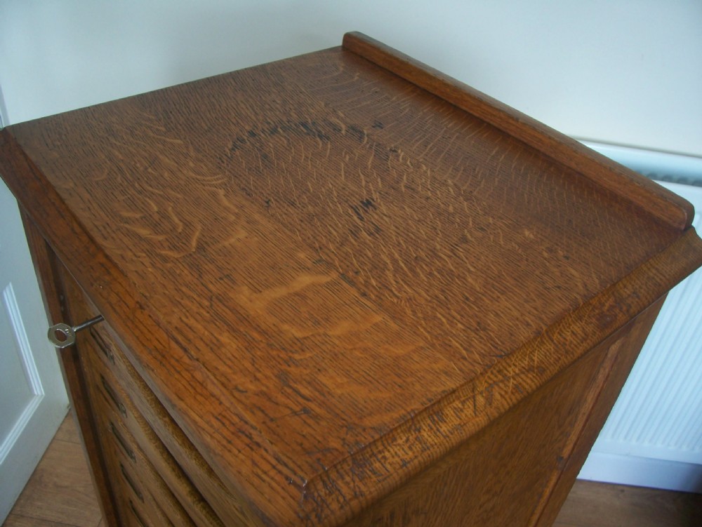 Single Edwardian oak filing cabinet with tambour front and 9 drawers 1 of 2 View VI