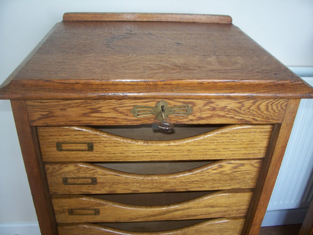 Single Edwardian oak filing cabinet with tambour front and 9 drawers 1 of 2 View IX