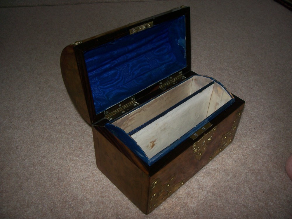 A Victorian burr walnut stationery box featuring a domed lid decorated with pierced brass mounts and corner straps. View IV