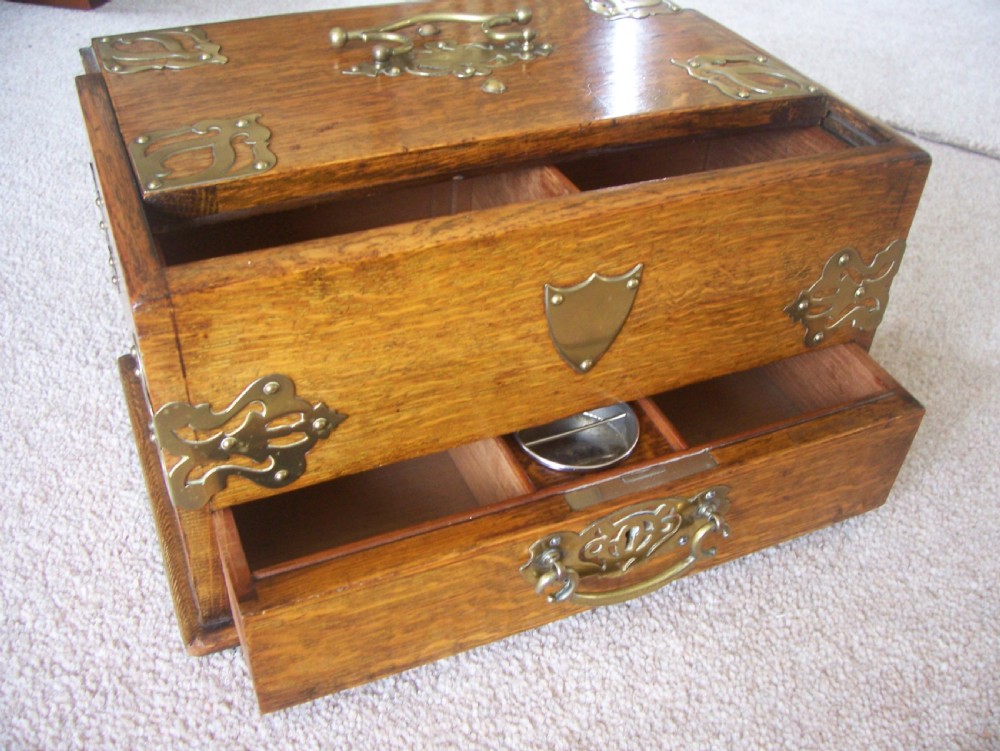 Victorian oak cigar box with brass mounts View X