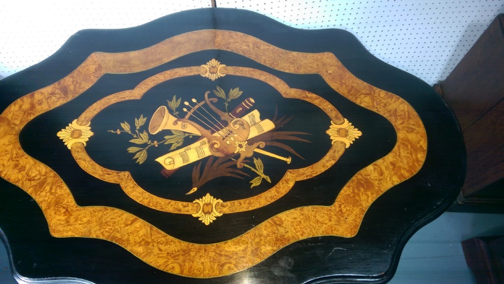Victorian ebonised and amboyna tilt top table music inlay View III
