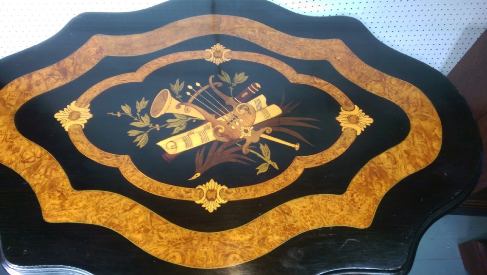 Victorian ebonised and amboyna tilt top table music inlay View IV