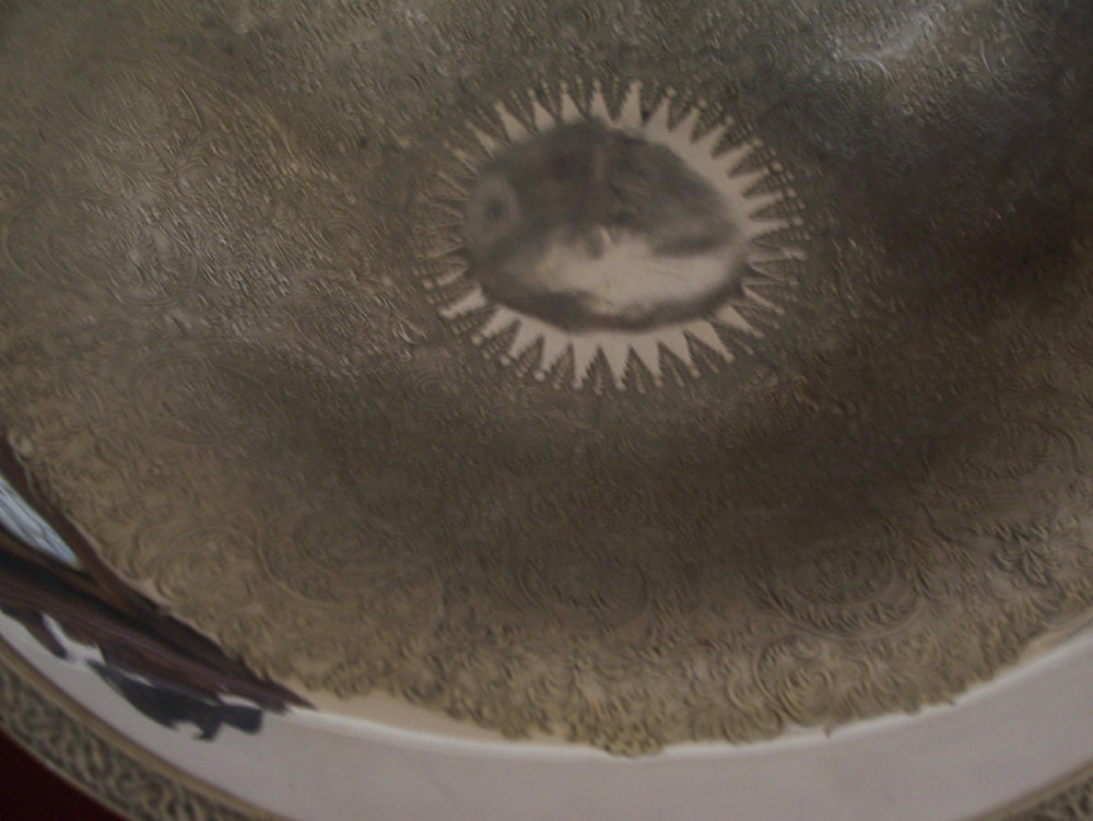 A Victorian silver-plated oval cake basket featuring a twisted overhead swing handle and a raised pedestal base. View IX