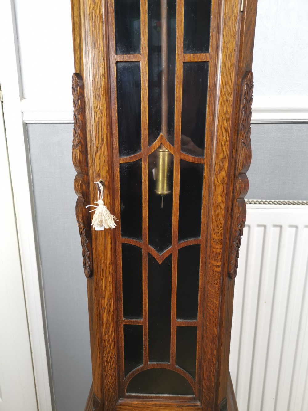Quarter Chiming & Hour Striking English Dwarf Grandfather or Grandmother Musical Longcase Clock of Good Warm Oak & Astagal Glazed Trunk Door on Bun Feet.  View IV