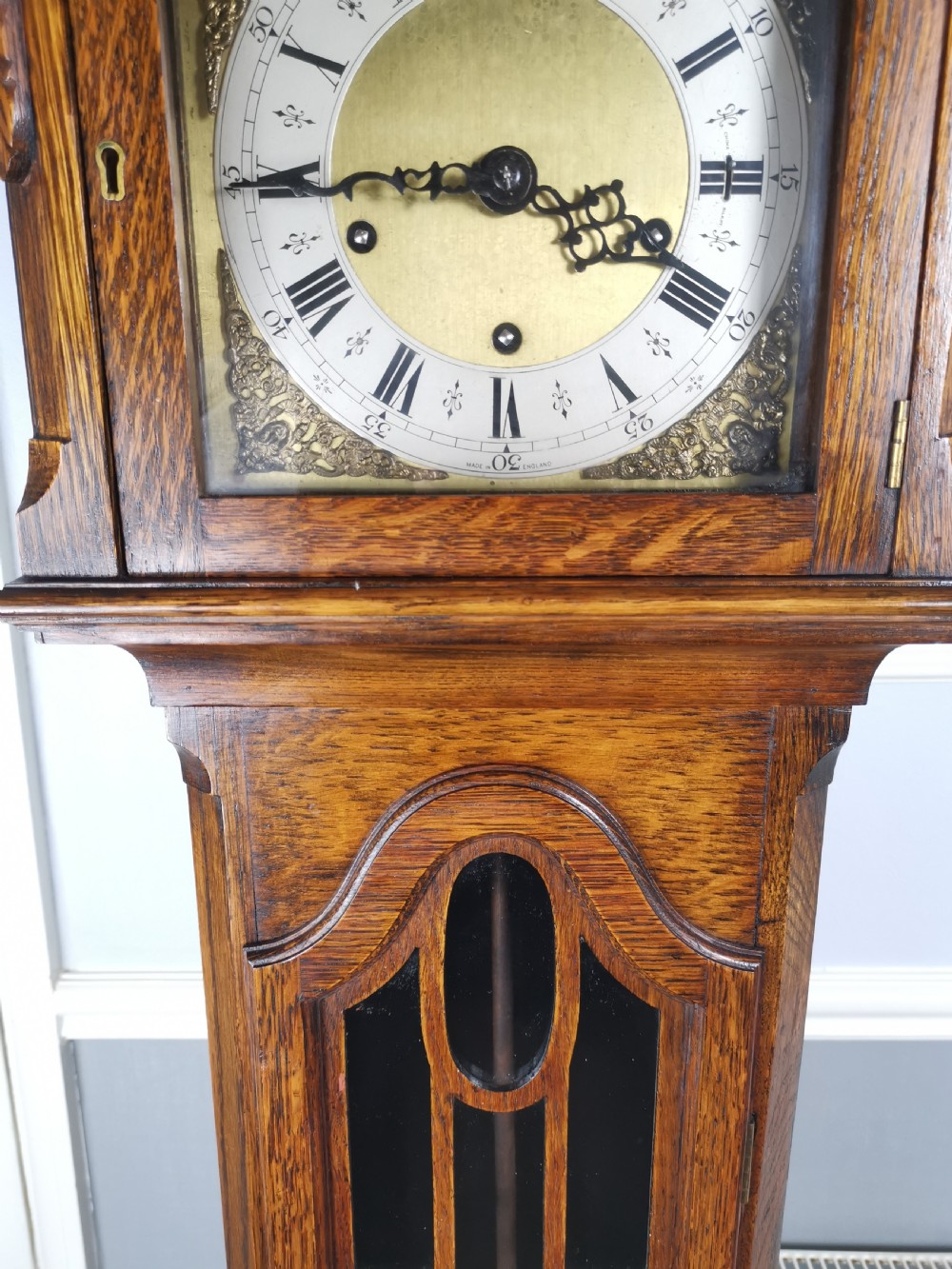 Quarter Chiming & Hour Striking English Dwarf Grandfather or Grandmother Musical Longcase Clock of Good Warm Oak & Astagal Glazed Trunk Door on Bun Feet.  View V