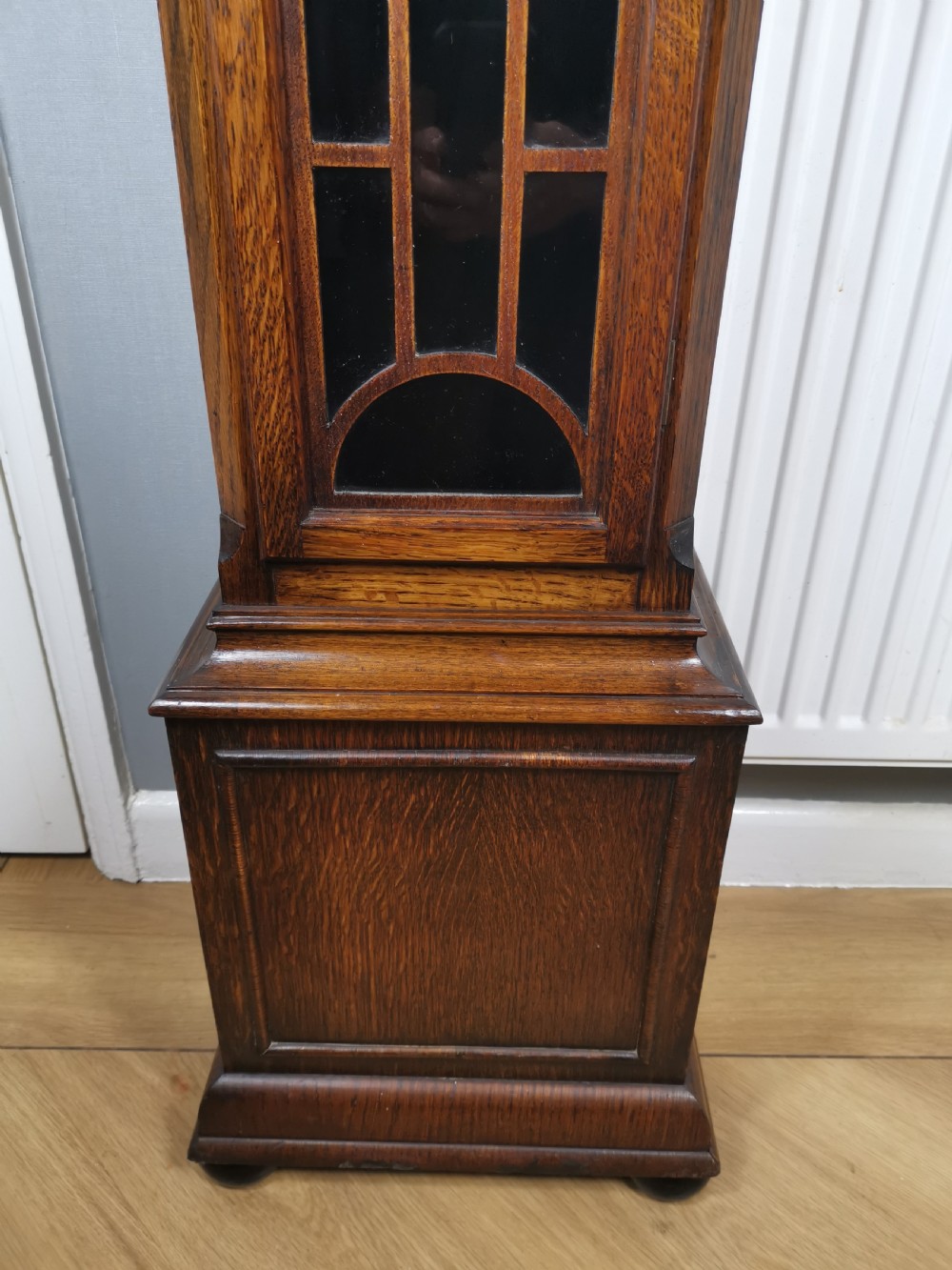 Quarter Chiming & Hour Striking English Dwarf Grandfather or Grandmother Musical Longcase Clock of Good Warm Oak & Astagal Glazed Trunk Door on Bun Feet.  View VI