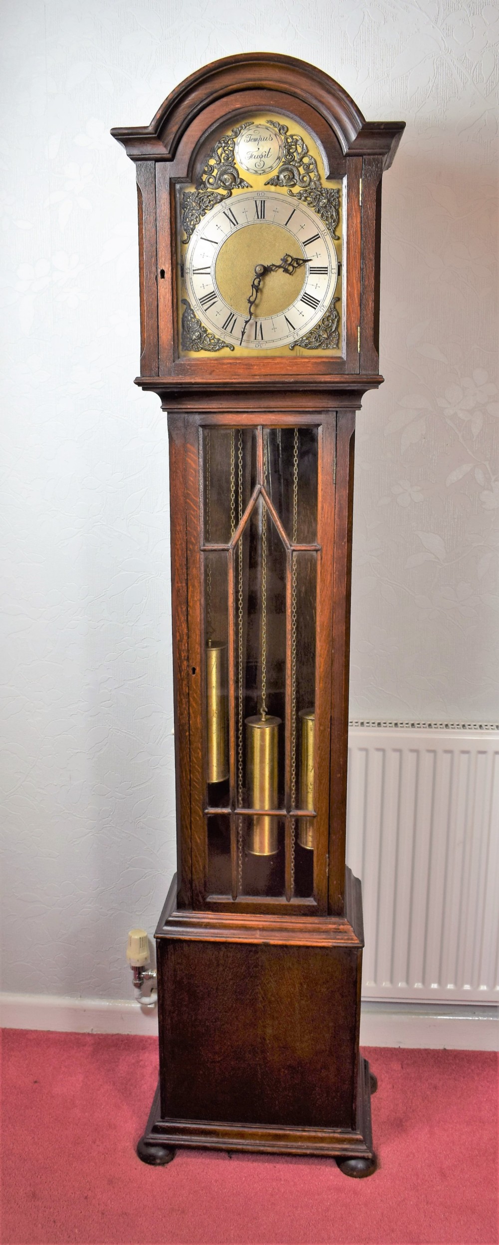 Astragal Glazed Triple Weight Oak Grandmother or Grandfather Longcase Clock with Good Quality Embee 8 Day Movement Playing Mellow Westminster Musical Chimes on Each Quarter.