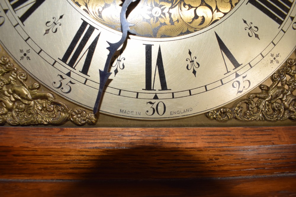 English Triple Weight Westminster Musical Chiming Grandmother or Grandfather English Oak with Glazed Trunk Door Longcase Clock. Circa 1920s View VI