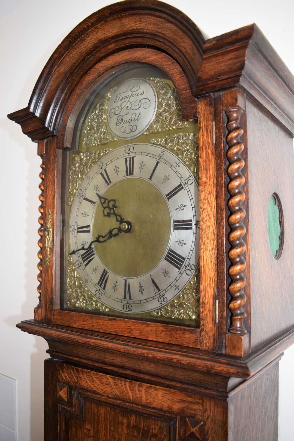 English Triple Weight Musical Chiming Grandmother or Grandfather Oak Longcase Clock with Barley Twist Columns Circa 1920 View III