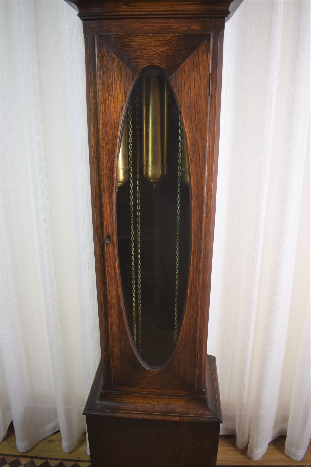Small (Under 70in) Grandmother or Grandfather Oak Longcase Triple Weight Musical Quarter Chiming Clock with Underslung Rheingold-Gongs  View III