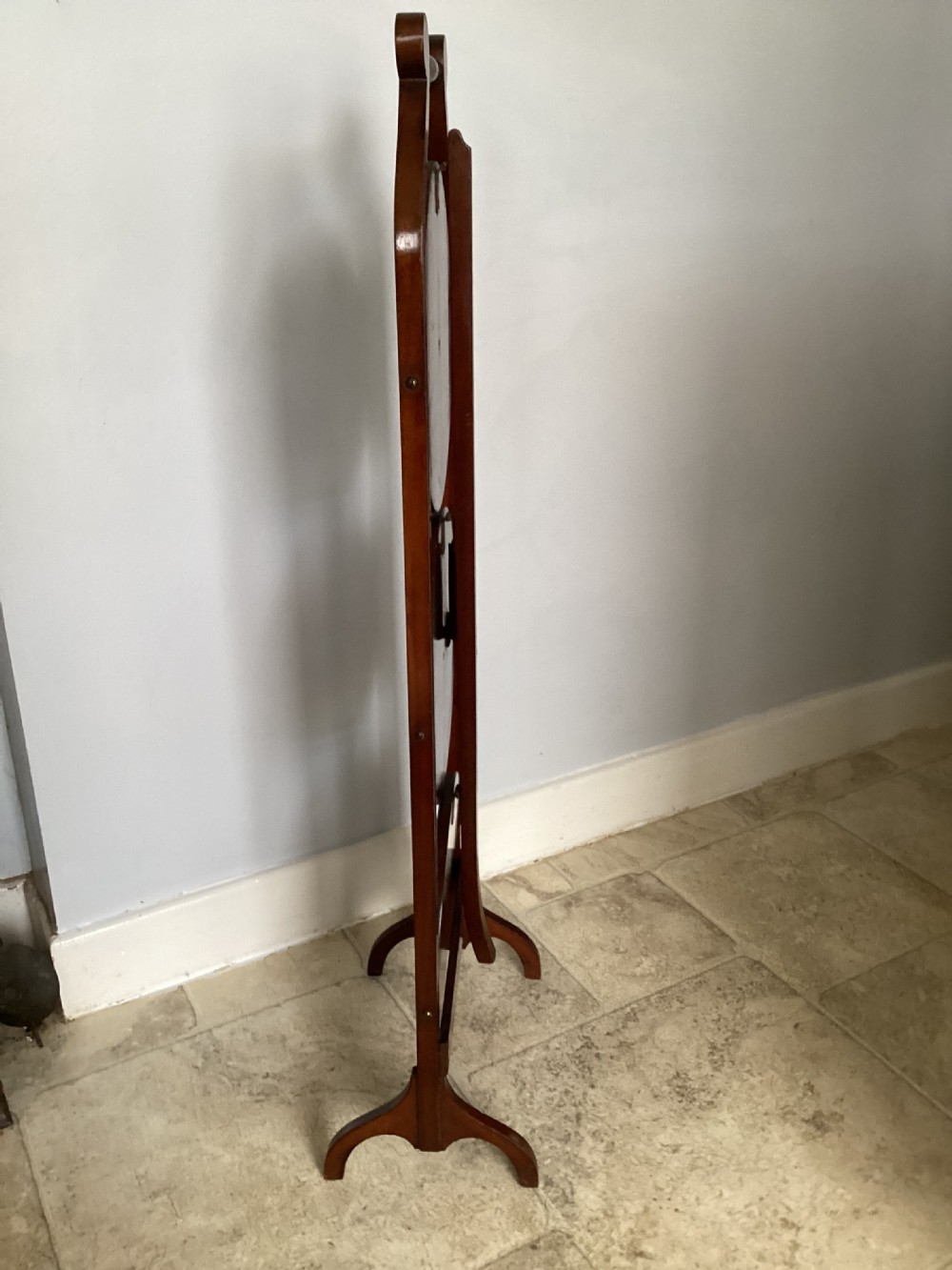A three-tier Edwardian mahogany folding cake stand featuring circular recessed trays and a curved carrying handle at the top. View V