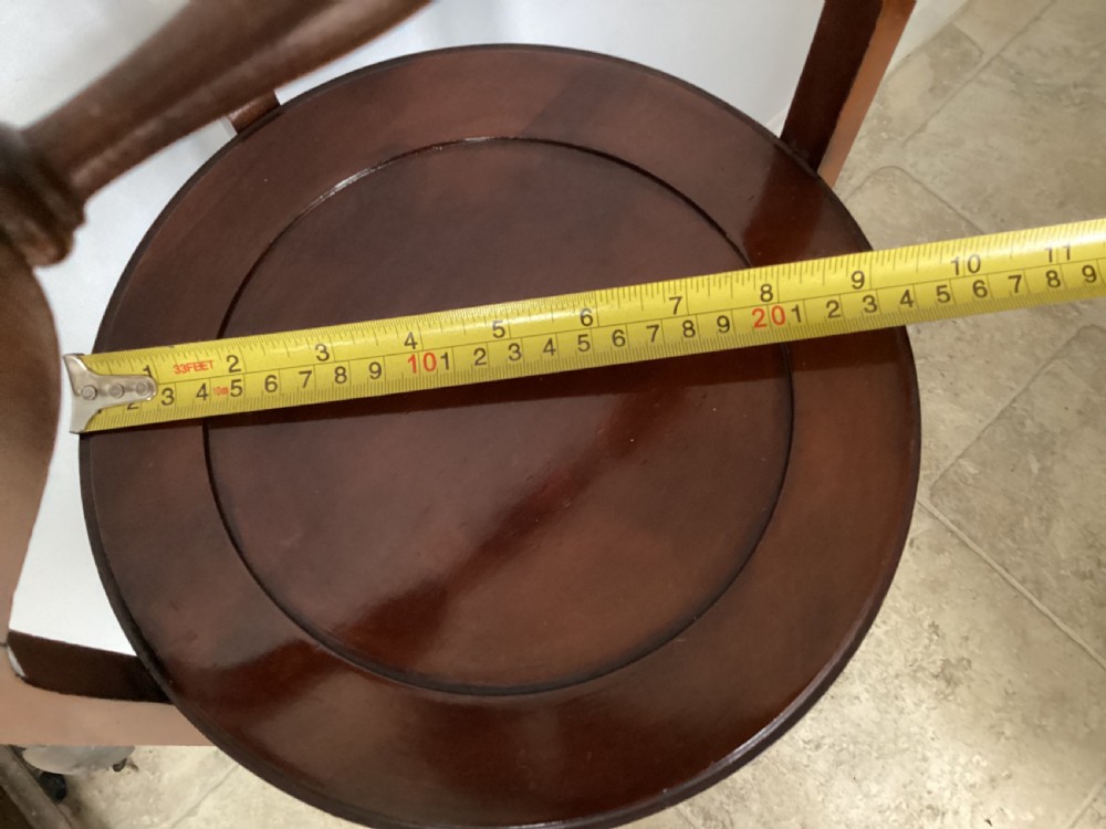 A three-tier Edwardian mahogany folding cake stand featuring circular recessed trays and a curved carrying handle at the top. View VIII