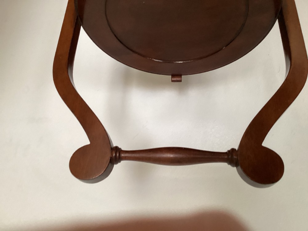 A three-tier Edwardian mahogany folding cake stand featuring circular recessed trays and a curved carrying handle at the top. View IX