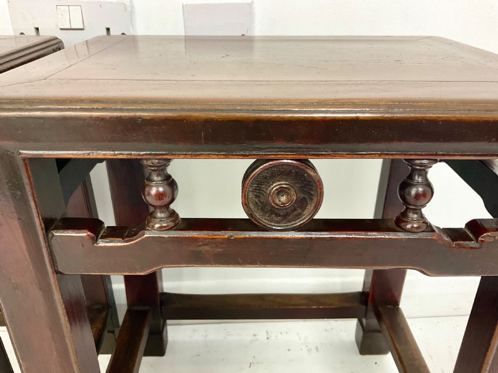 A pair of dark hardwood rectangular Chinese occasional tables featuring carved aprons with central circular medallions and turned baluster supports. View III