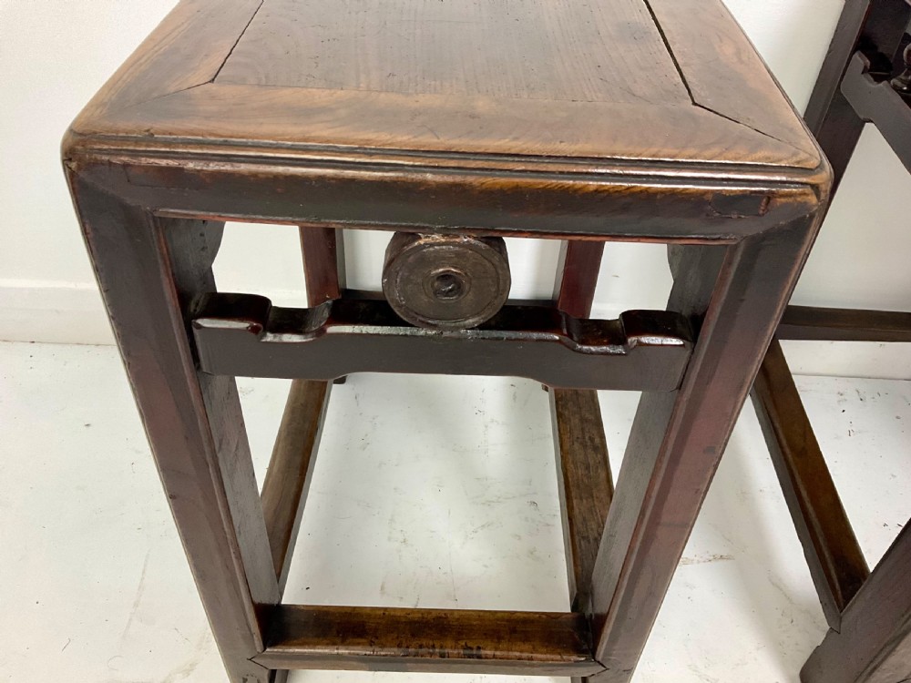A pair of dark hardwood rectangular Chinese occasional tables featuring carved aprons with central circular medallions and turned baluster supports. View V