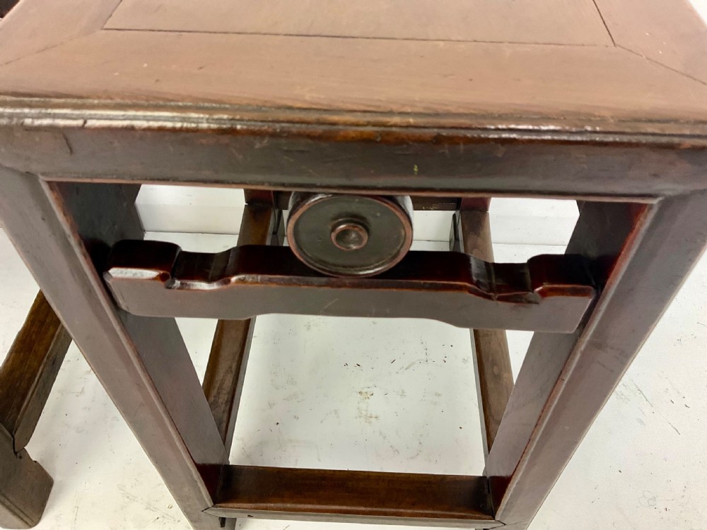 A pair of dark hardwood rectangular Chinese occasional tables featuring carved aprons with central circular medallions and turned baluster supports. View VI