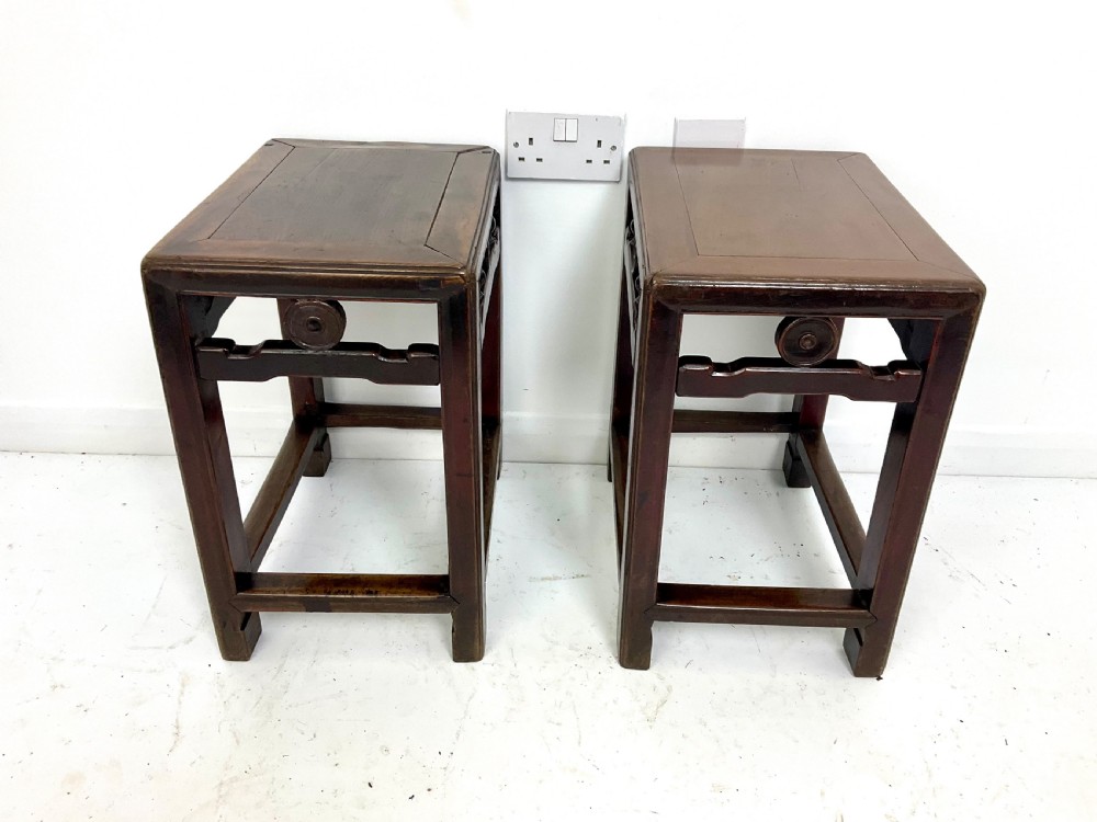 A pair of dark hardwood rectangular Chinese occasional tables featuring carved aprons with central circular medallions and turned baluster supports. View VII