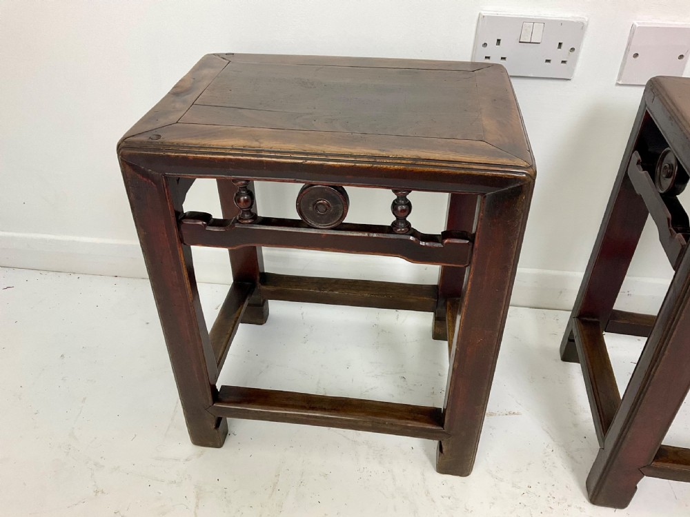 A pair of dark hardwood rectangular Chinese occasional tables featuring carved aprons with central circular medallions and turned baluster supports. View VIII