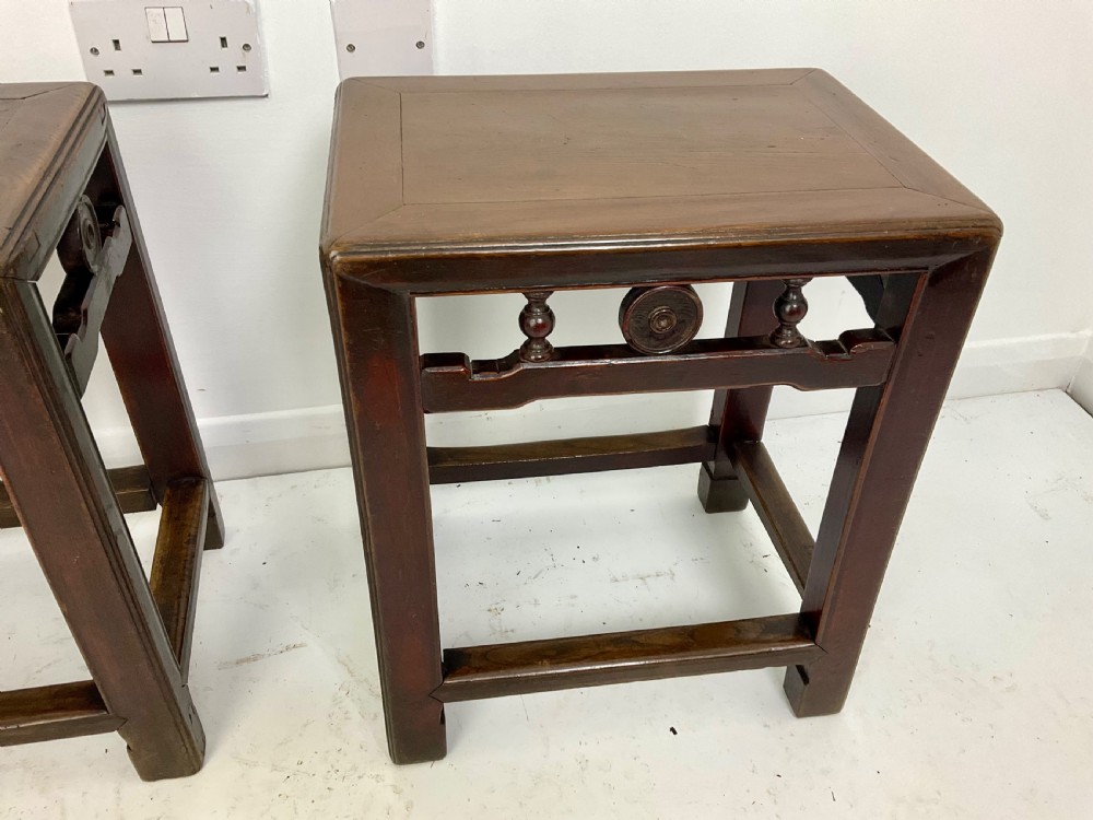 A pair of dark hardwood rectangular Chinese occasional tables featuring carved aprons with central circular medallions and turned baluster supports. View IX