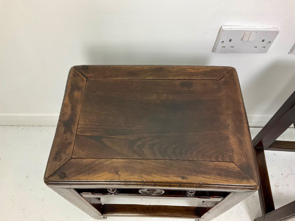 A pair of dark hardwood rectangular Chinese occasional tables featuring carved aprons with central circular medallions and turned baluster supports. View X