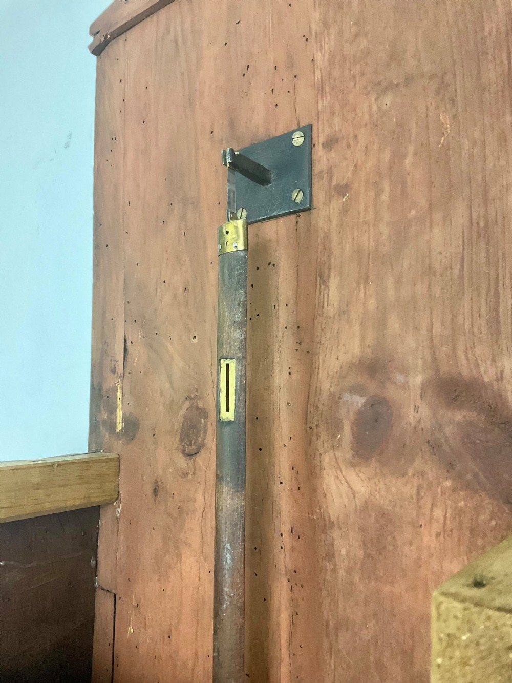A late Georgian mahogany longcase clock featuring a swan-neck pediment, twisted columns, and an arched dial with silvered chapter ring. View VI