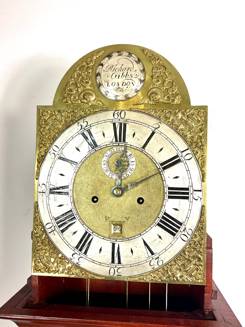 An 18th-century Georgian mahogany longcase clock featuring an arched brass dial with an engraved maker silvered boss and brass spandrels. View XI