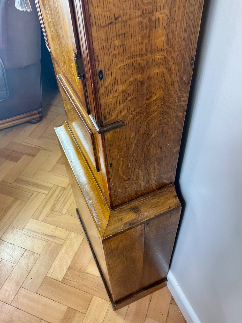 An 18th-century Georgian oak and mahogany longcase clock featuring a swan-neck pediment, fluted columns, and a painted dial face signed by Preddy of Langport. View III