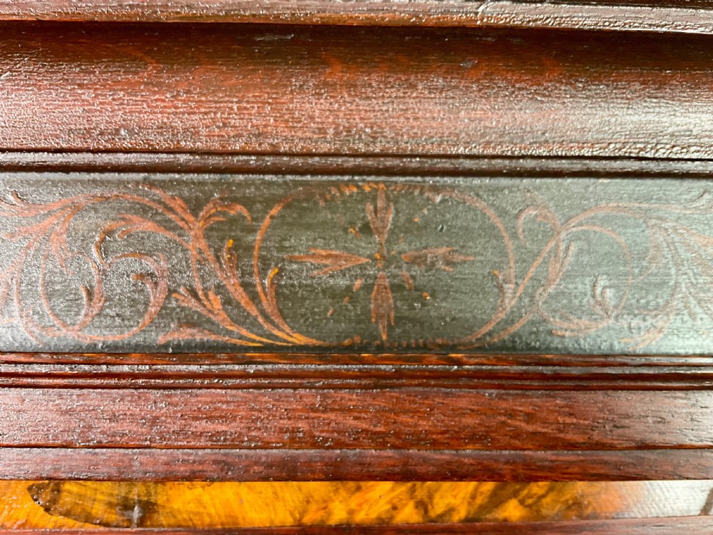 A tall Georgian dark oak longcase clock featuring an engraved brass square dial, fluted quarter-columns, and a shaped trunk door. View IX