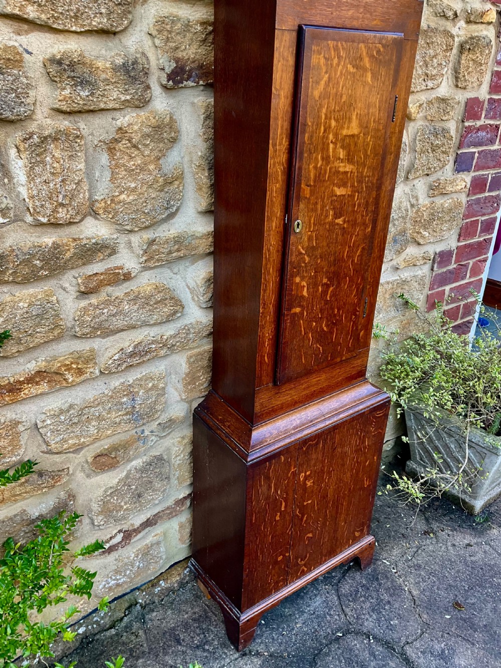 A tall Georgian longcase clock crafted from rich oak and mahogany featuring a swan-neck pediment hood and a hand-painted square dial. View III