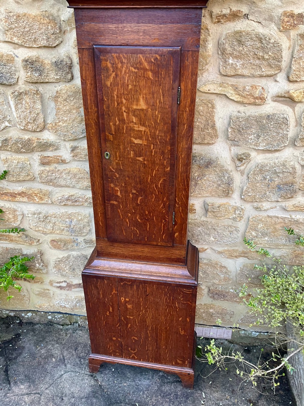 A tall Georgian longcase clock crafted from rich oak and mahogany featuring a swan-neck pediment hood and a hand-painted square dial. View IV