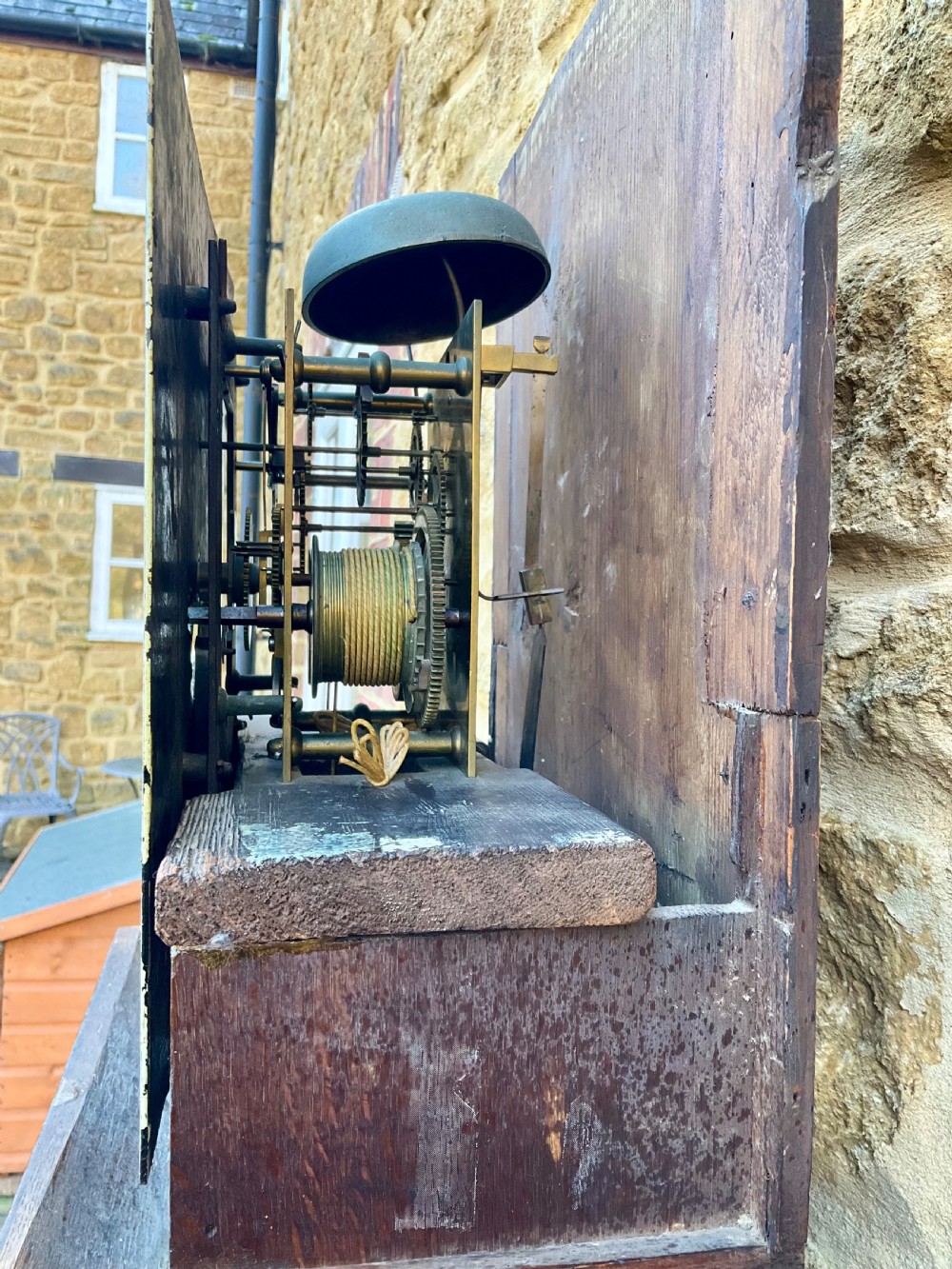 A tall Georgian longcase clock crafted from rich oak and mahogany featuring a swan-neck pediment hood and a hand-painted square dial. View V