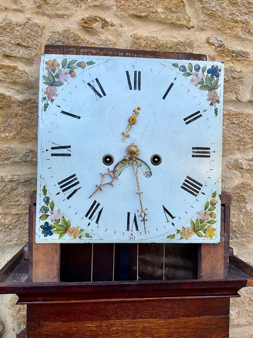 A tall Georgian longcase clock crafted from rich oak and mahogany featuring a swan-neck pediment hood and a hand-painted square dial. View VII