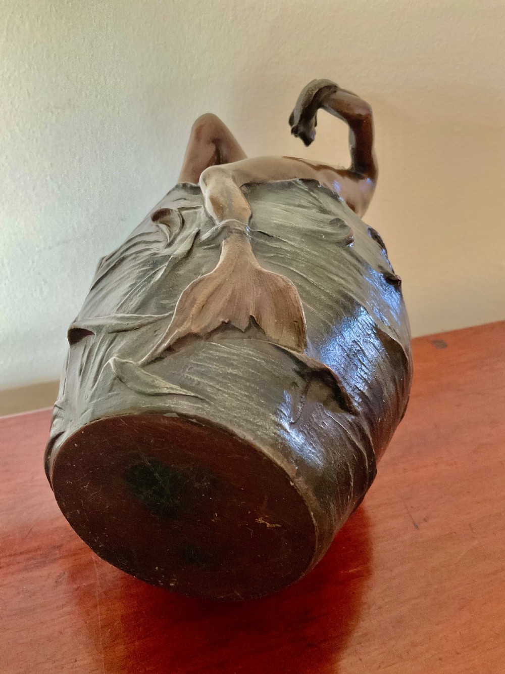 A dark patinated bronze Art Nouveau vase featuring a relief sculpture of a reclining female nymph on its side. View IV