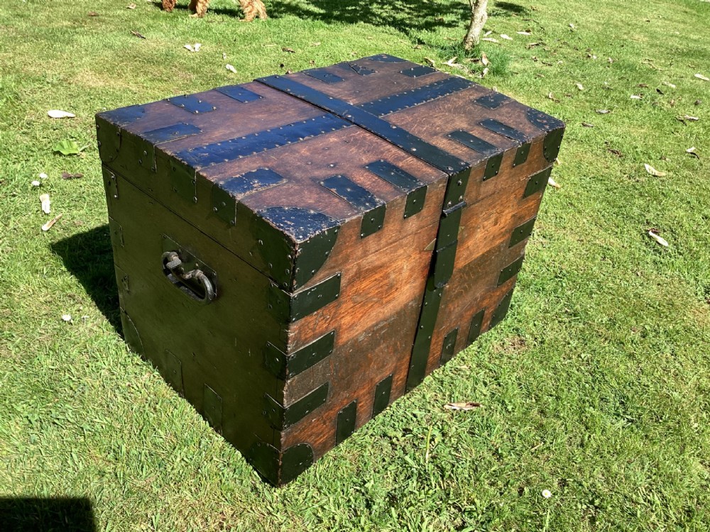 A 19th-century dark oak silver chest featuring black metal binding straps, corner plates, and central locking mechanism. View III