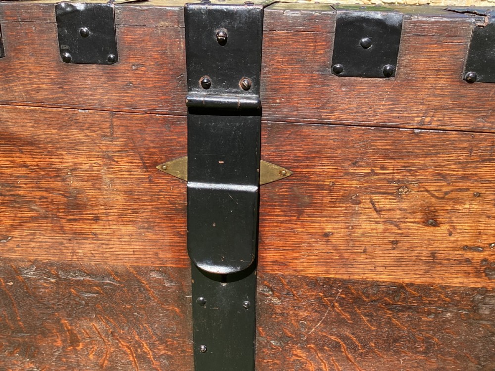A 19th-century dark oak silver chest featuring black metal binding straps, corner plates, and central locking mechanism. View IV