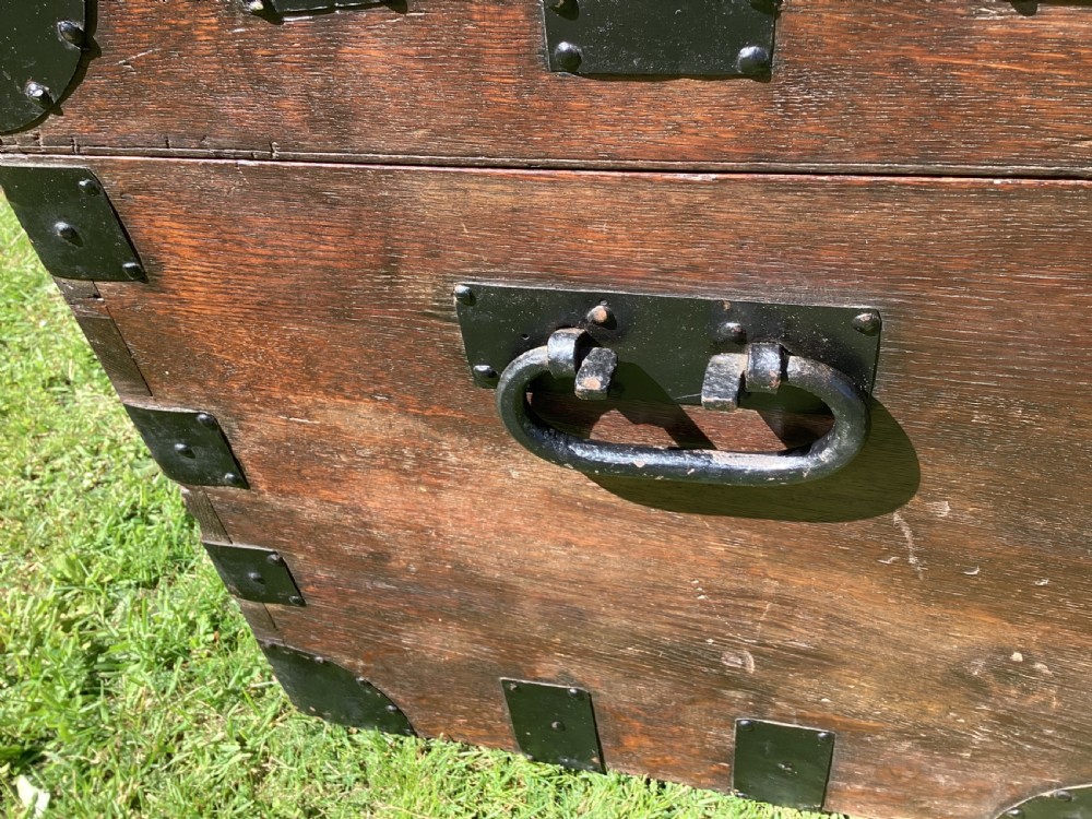 A 19th-century dark oak silver chest featuring black metal binding straps, corner plates, and central locking mechanism. View XI