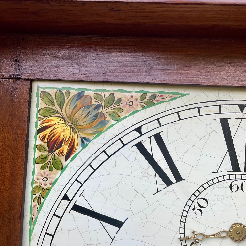A Georgian oak and mahogany longcase clock featuring a swan-neck pediment, fluted hood columns, and a painted square dial. View VI