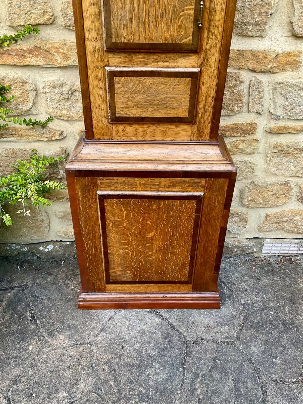 A Georgian oak and mahogany longcase clock featuring a swan-neck pediment, fluted hood columns, and a painted square dial. View VIII