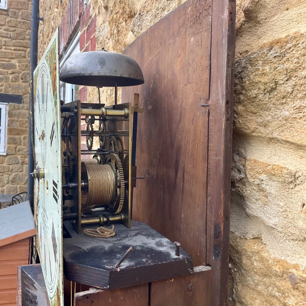 A Georgian oak and mahogany longcase clock featuring a swan-neck pediment, fluted hood columns, and a painted square dial. View X