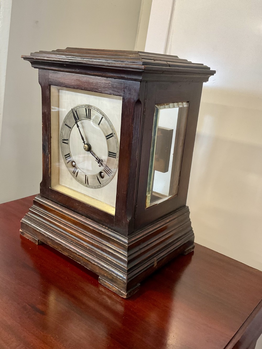 A Victorian dark mahogany five-glass bracket clock featuring a square white dial with Roman numerals and a stepped moulded base. View III