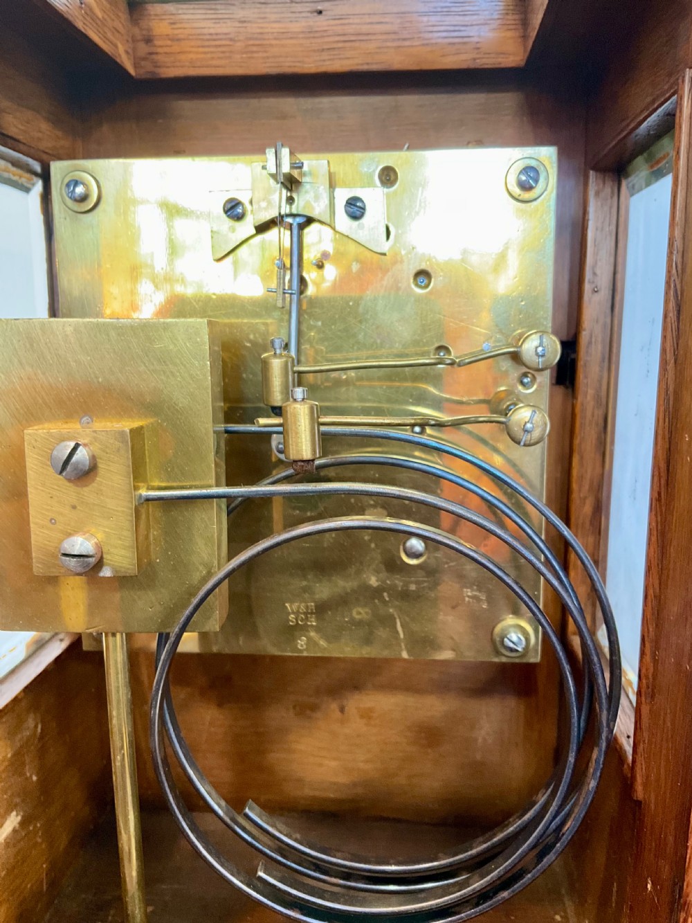 A Victorian dark mahogany five-glass bracket clock featuring a square white dial with Roman numerals and a stepped moulded base. View VIII