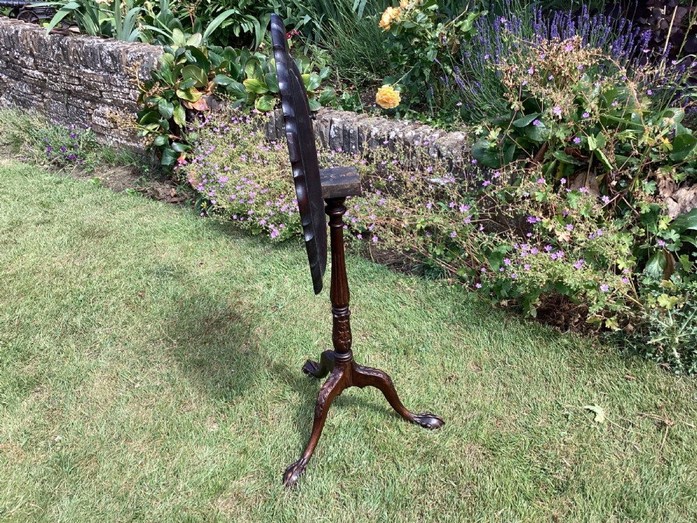 A dark mahogany tripod table featuring a scalloped piecrust tilt-top surface, turned column stem, and carved cabriole legs. View III