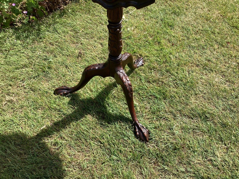 A dark mahogany tripod table featuring a scalloped piecrust tilt-top surface, turned column stem, and carved cabriole legs. View IV
