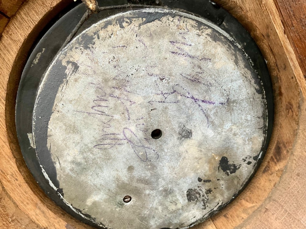 A 19th-century Black Forest aneroid barometer featuring a carved dark wood frame with leaf and acorn motifs surrounding a circular white ceramic dial. View IX