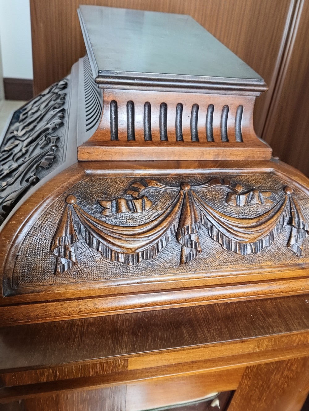 A Victorian carved mahogany twin fusee table clock featuring an ornate brass dial with silvered chapter ring and carved column details. View XIII
