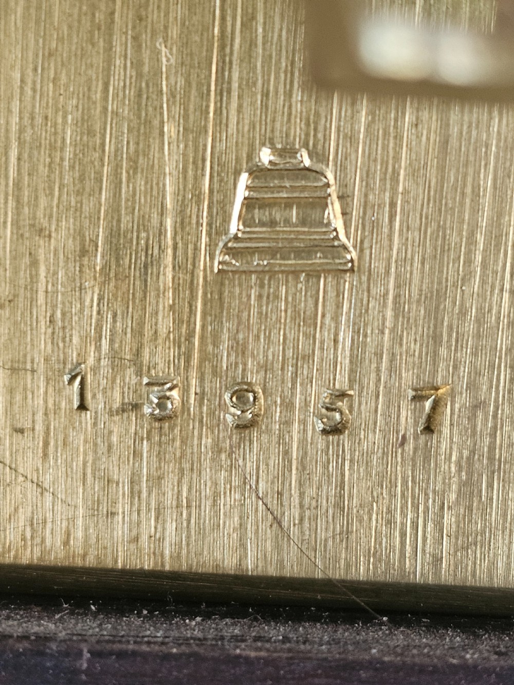 A tall dark oak longcase clock featuring rope twist columns, a square brass dial with silvered chapter ring, and a carved wooden casing. View XI